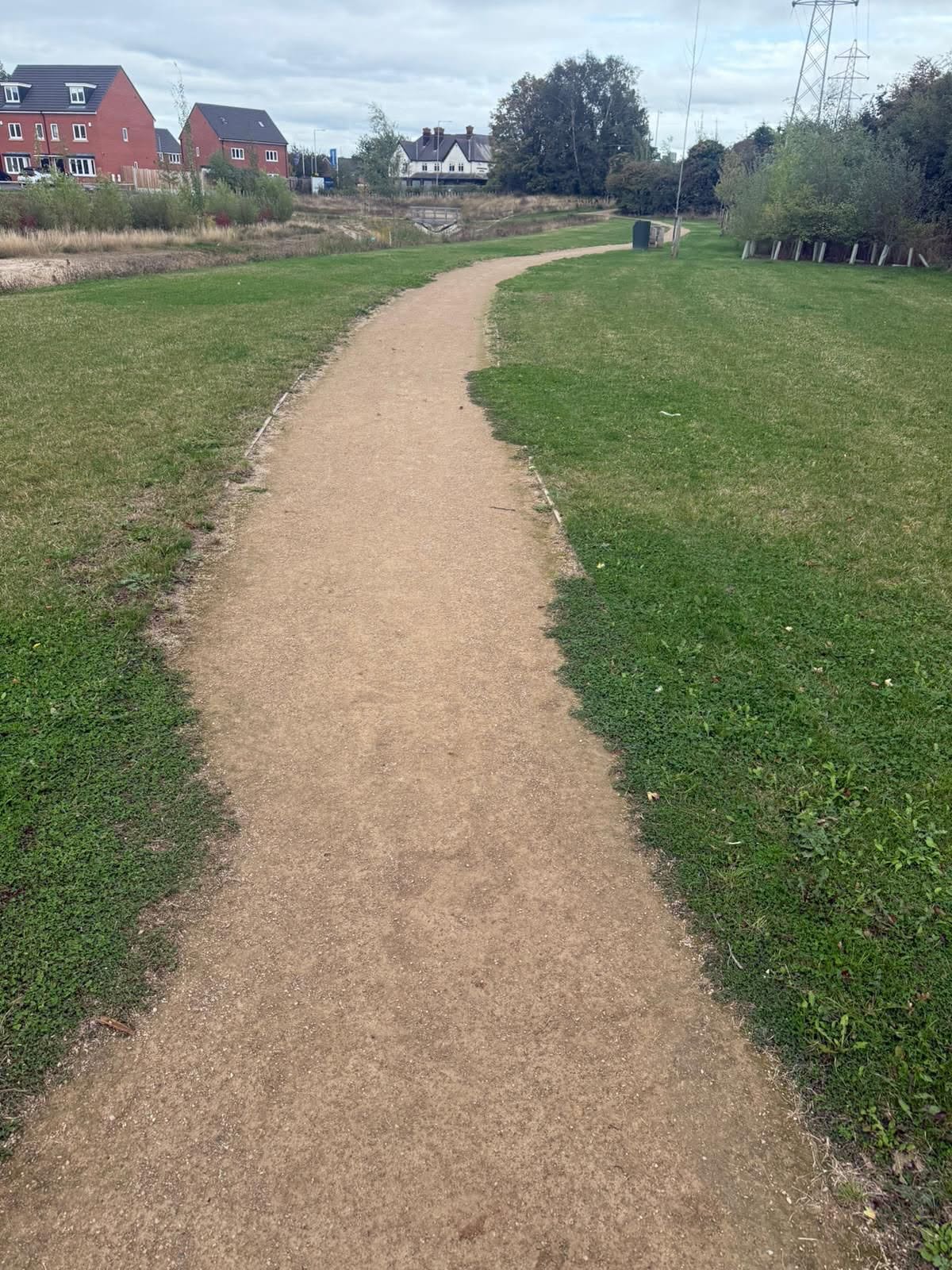 Maintained gravel pathway through mown communal lawns