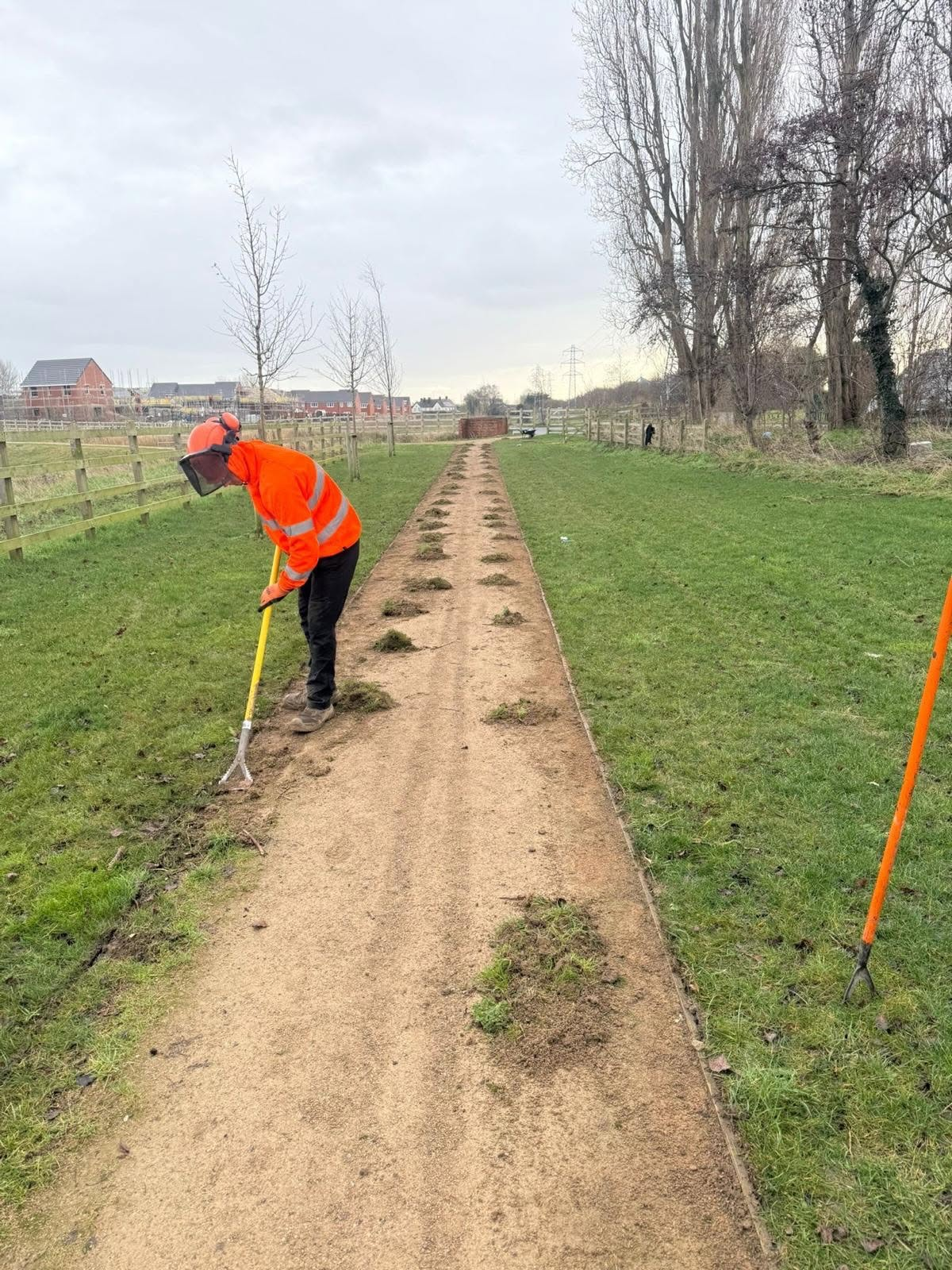 Grounds maintenance pathway clearance by DMS team