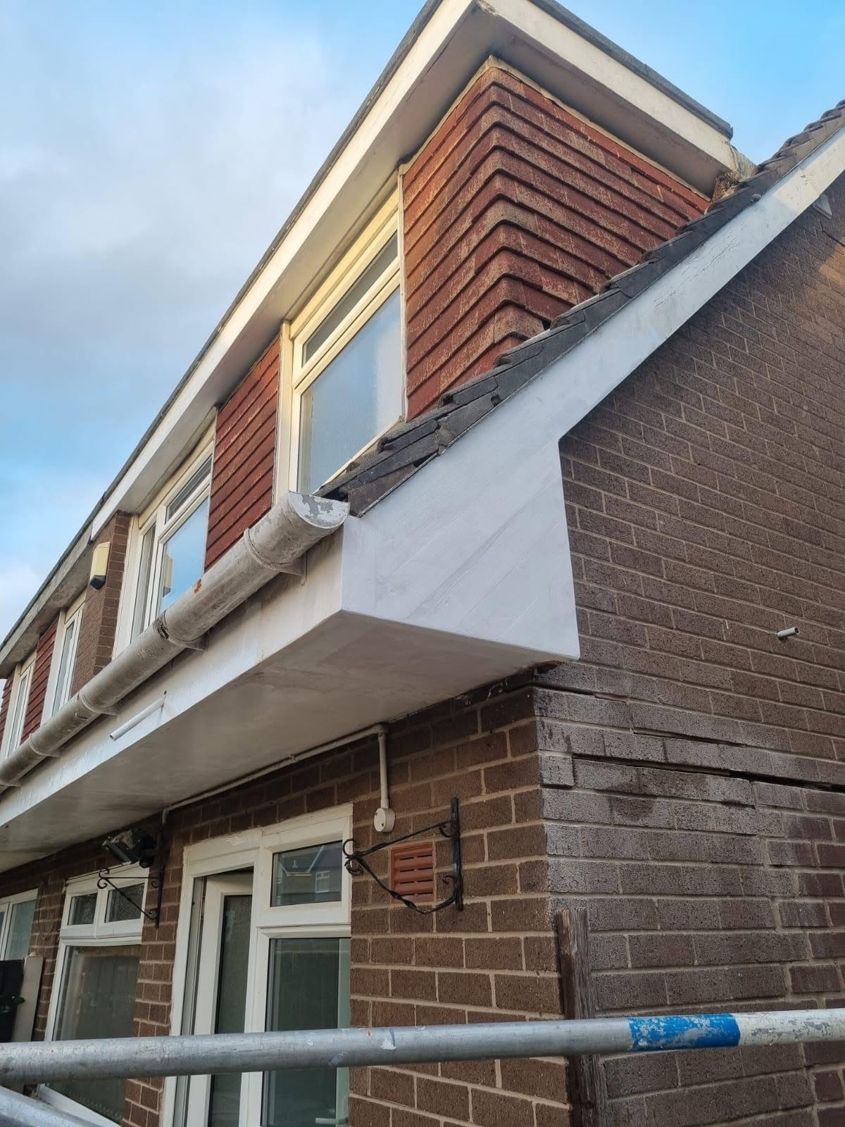Exterior fascia and soffit repainted in clean white gloss